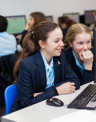 CCHSG students work together at a computer
